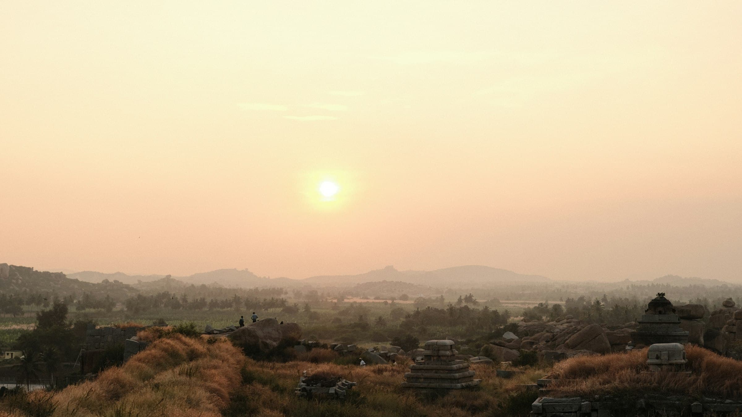 Sunset light over the ancient temple ruins of Hampi, once the Vijayanagara Empire's capital.