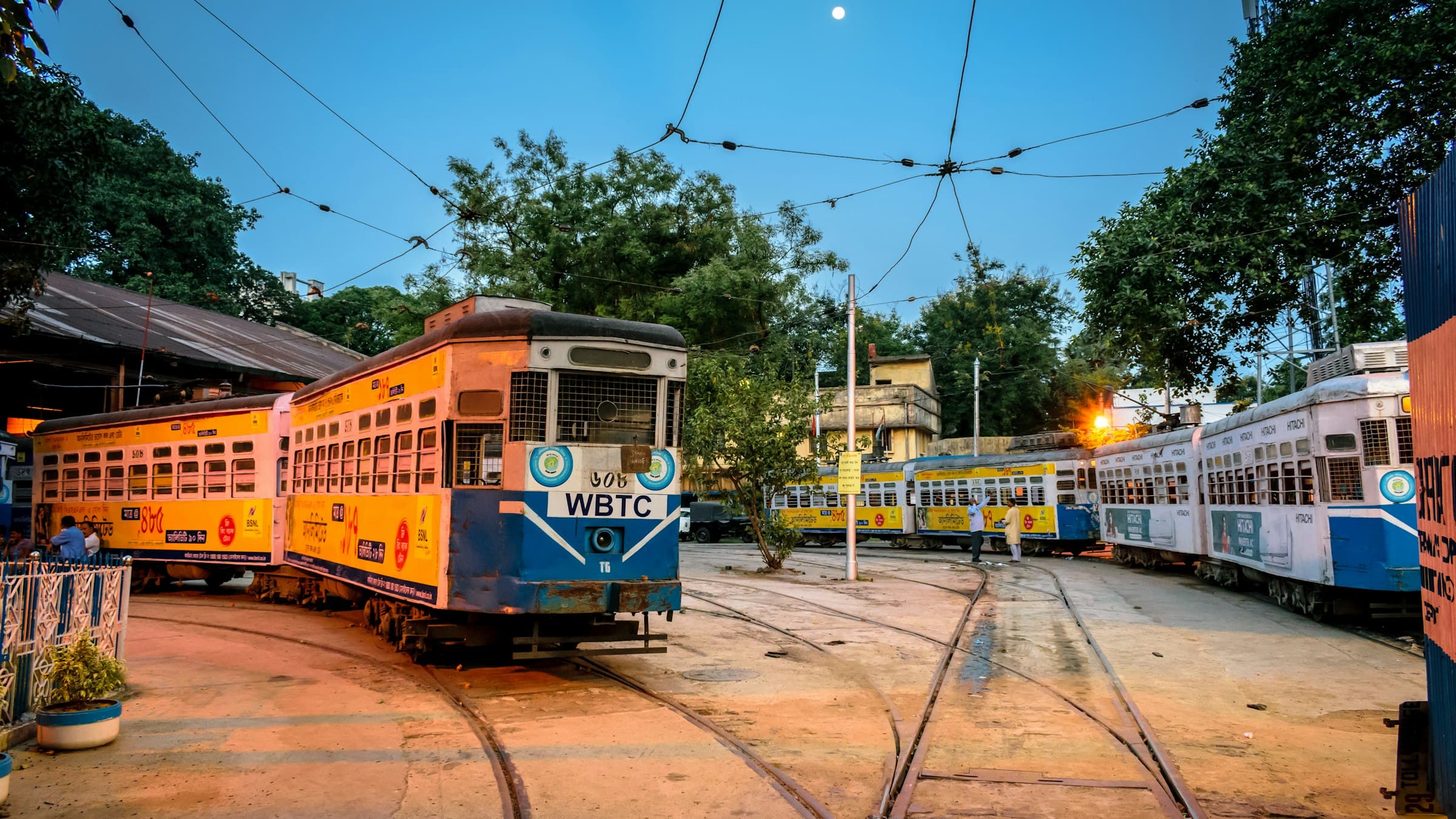 Yellow and white tram on a Kolkata street, West Bengal