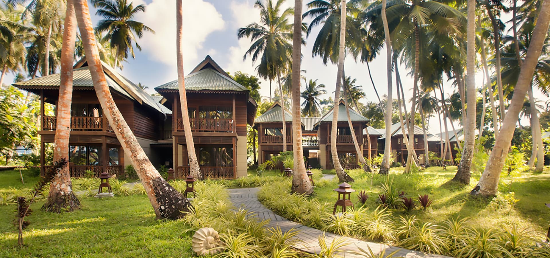 SeaShell Havelock resort grounds shaded by coconut groves along Govind Nagar Beach
