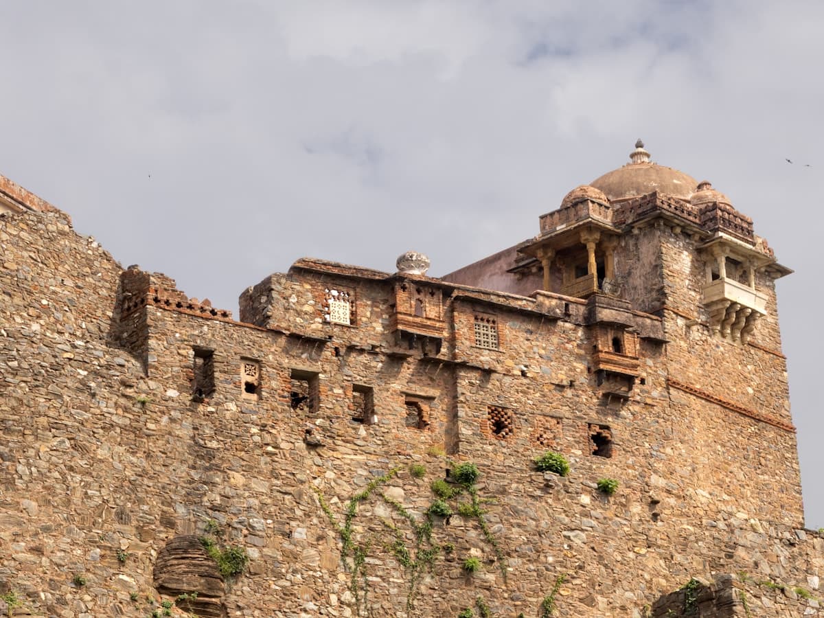 Kumbhalgarh Fort's weathered stone ramparts rising above the Aravalli hills