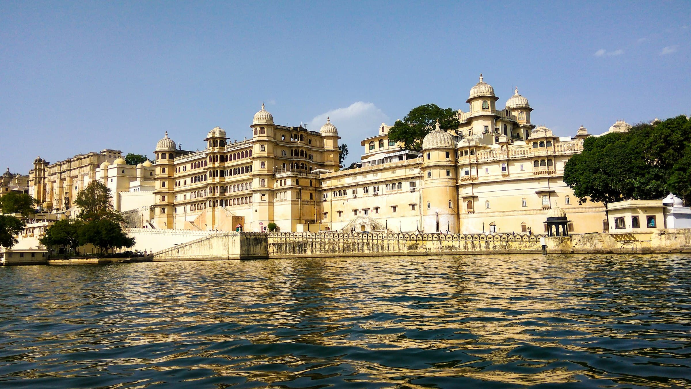 Udaipur's City Palace reflected in the still waters of Lake Pichola