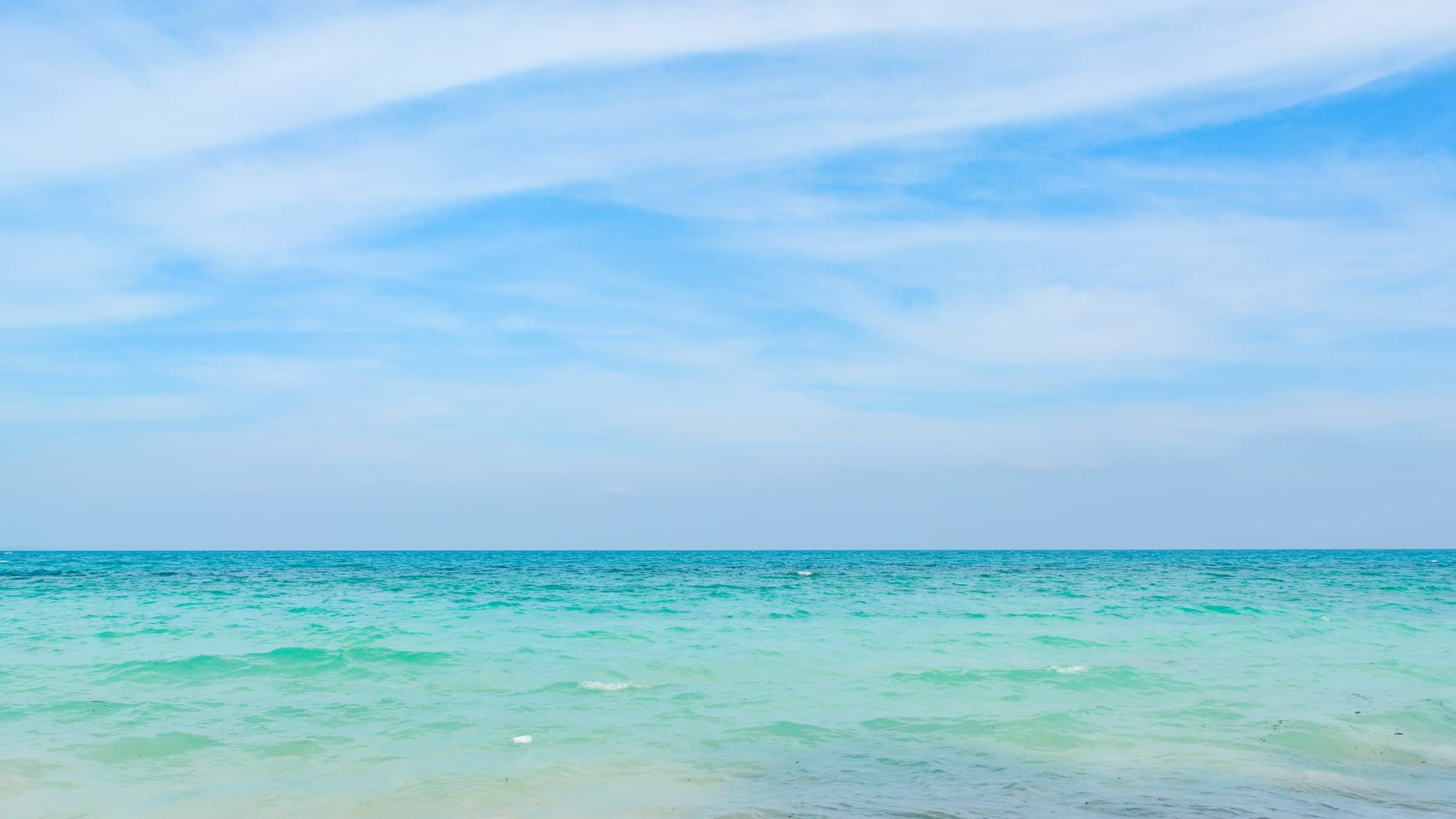 Pristine turquoise waters and pale sand at Radhanagar Beach, Havelock Island, Andaman Islands