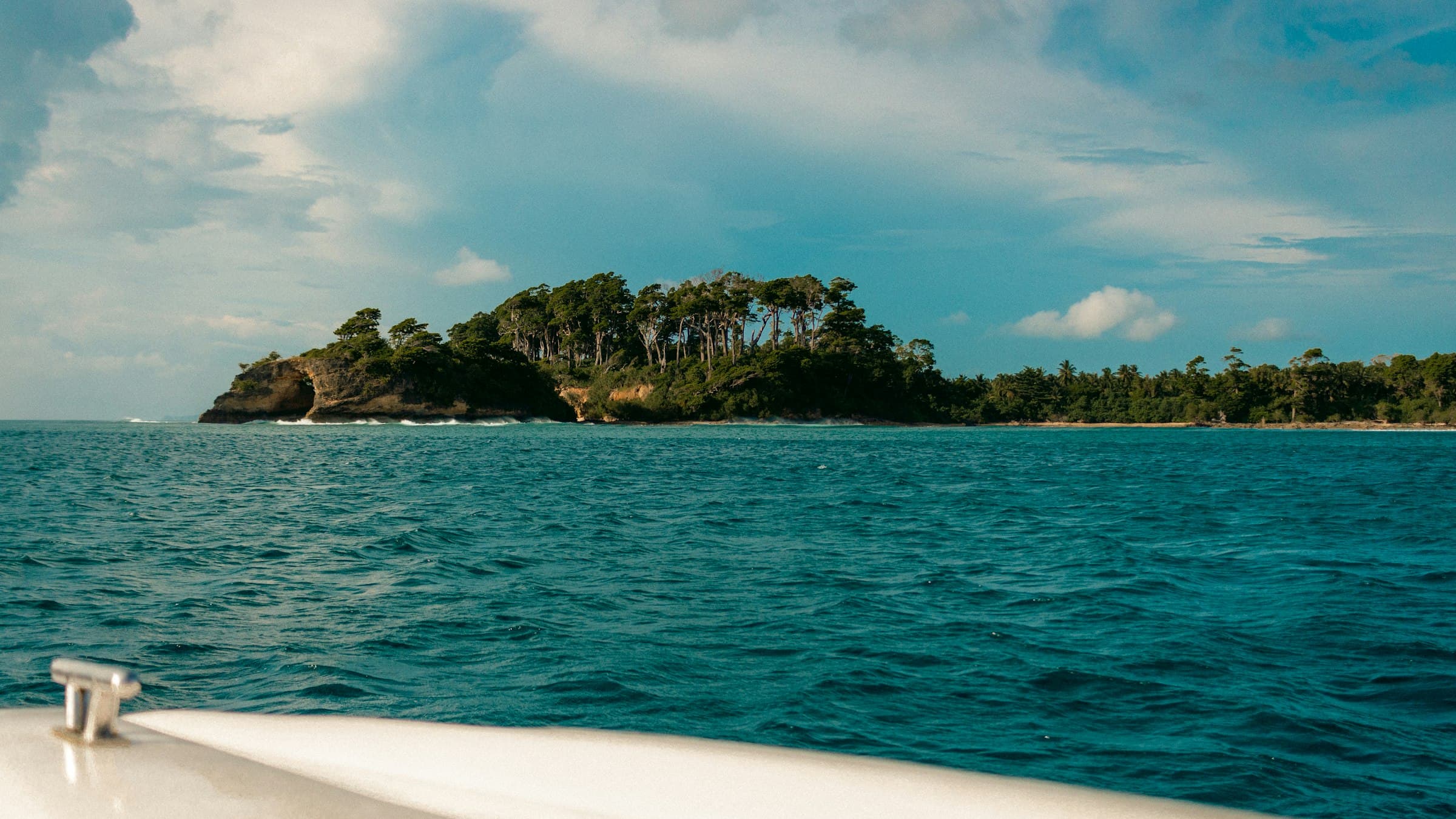 Small island surrounded by open water, seen during a speedboat ride around Neil Island, Andaman Islands