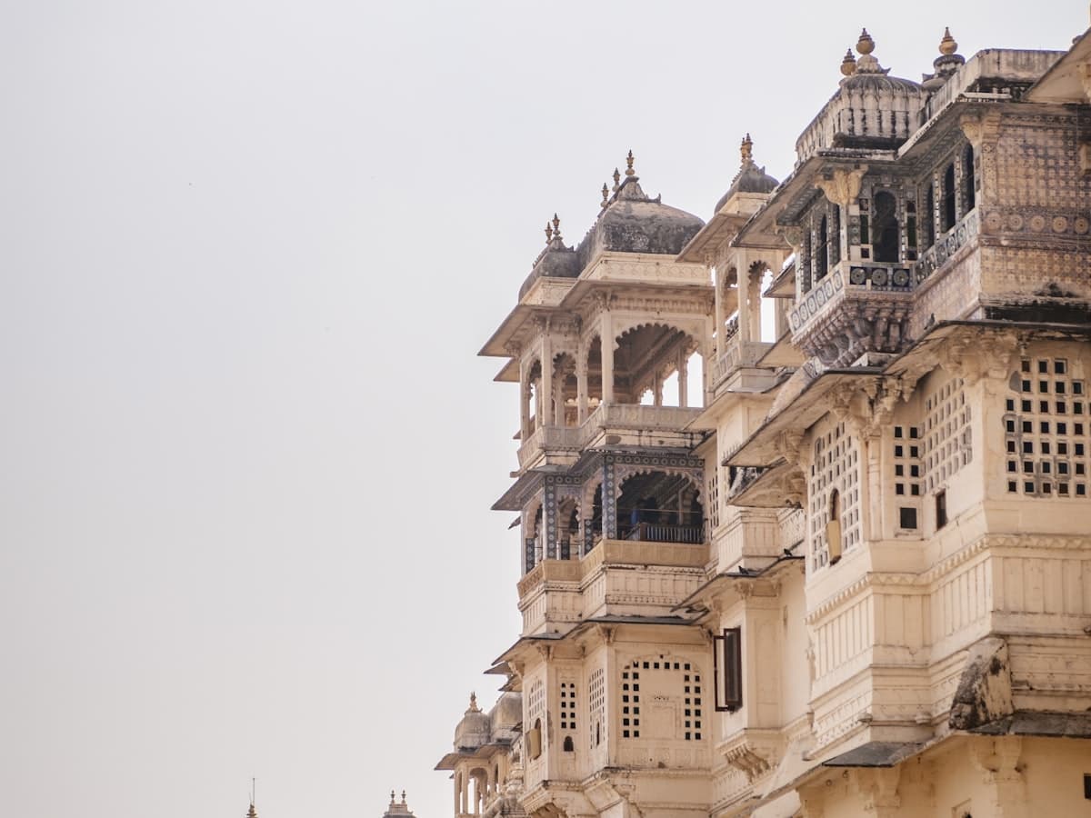 Udaipur City Palace's tiered cupolas and balconies rising above the old city