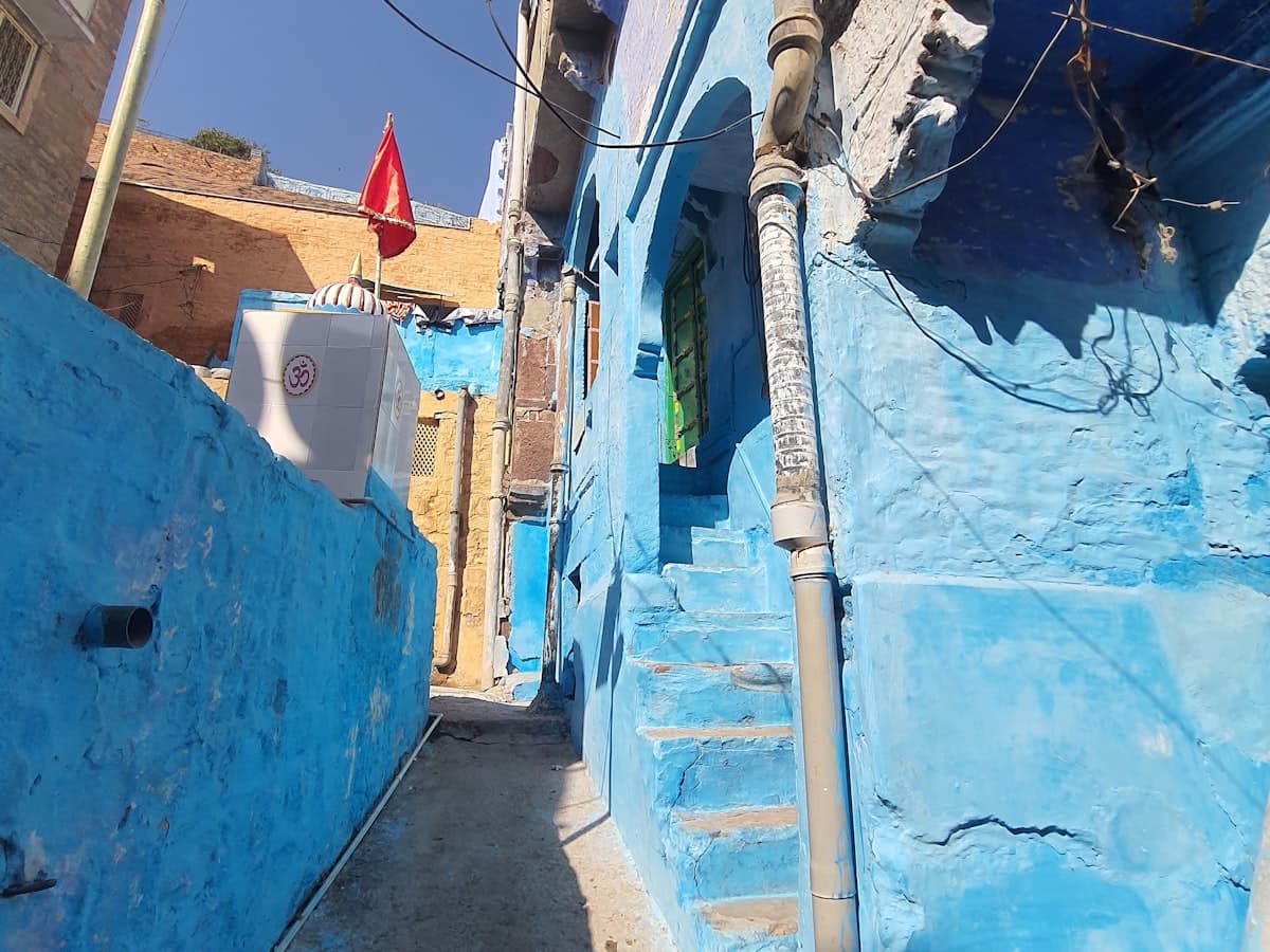 Jodhpur's Blue City narrow alleyway with blue-painted walls and traditional steps