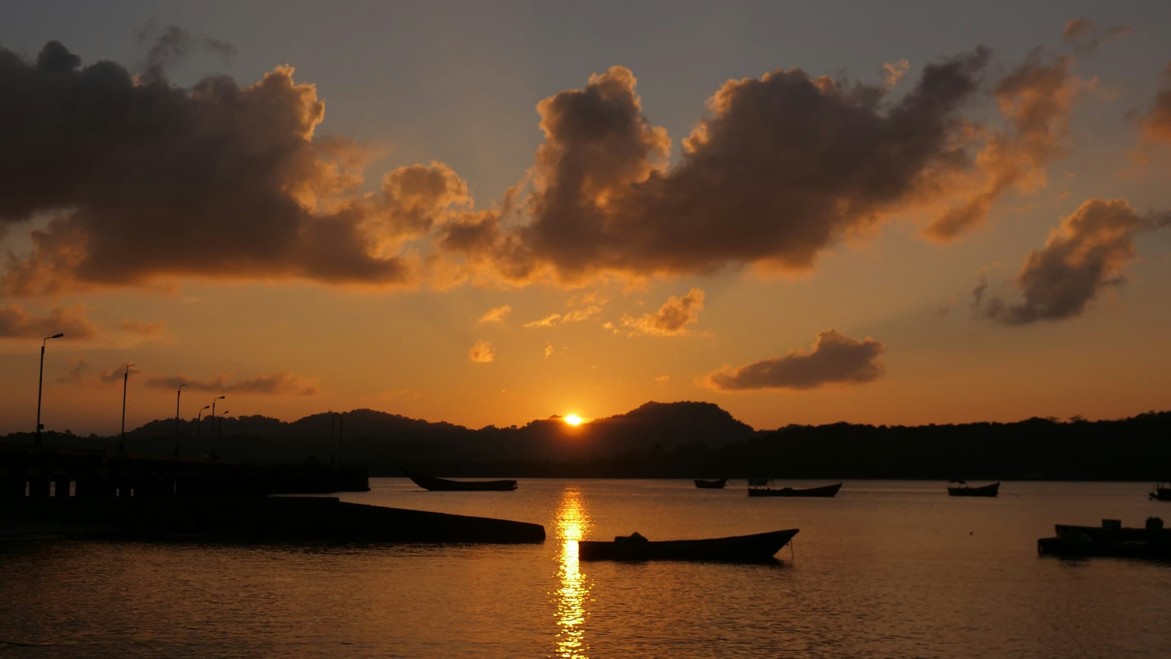 Small boats moored at sunset in the Andaman and Nicobar Islands