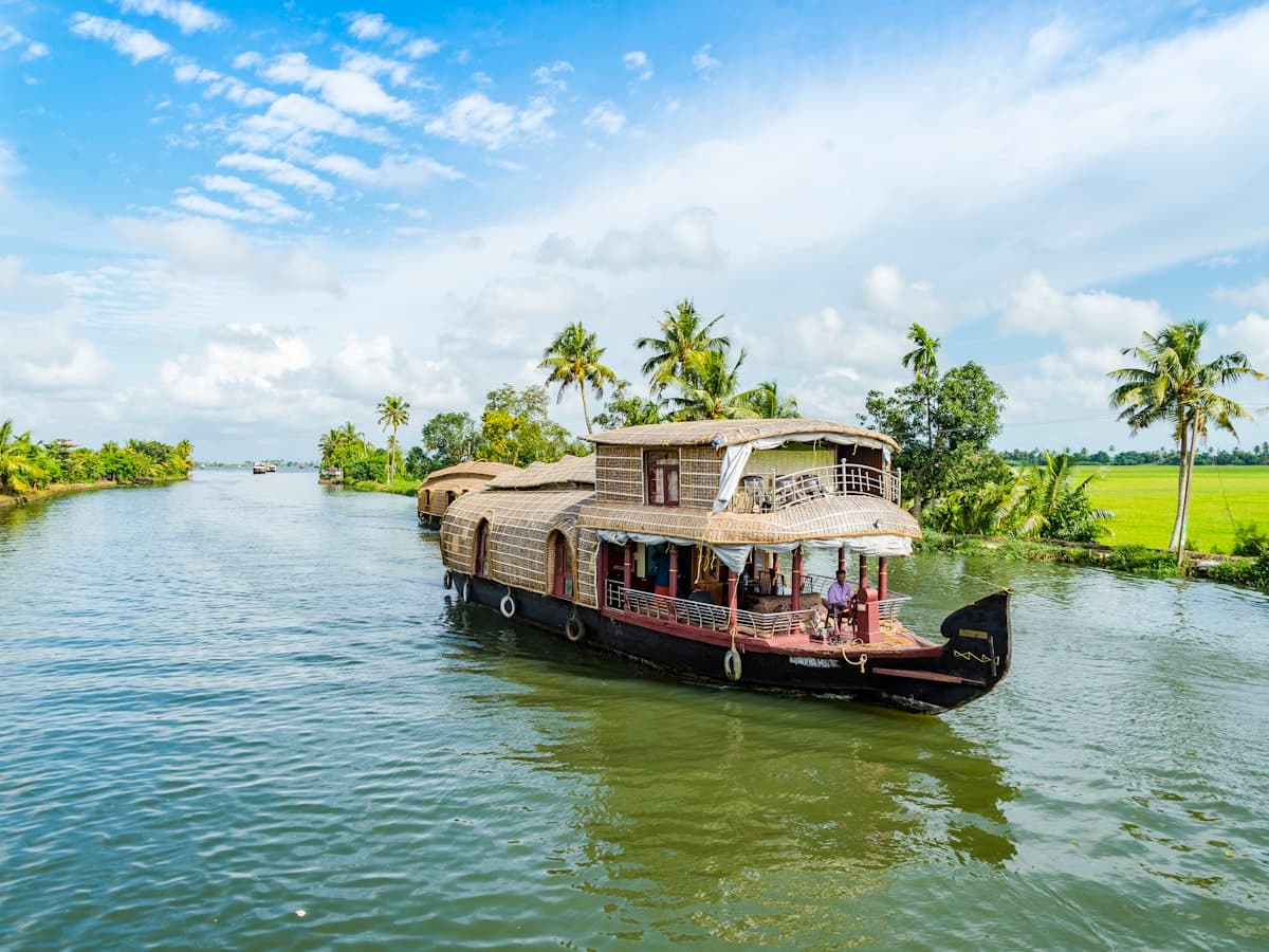 A traditional Kerala houseboat moored on the palm-lined backwaters at Alappuzha
