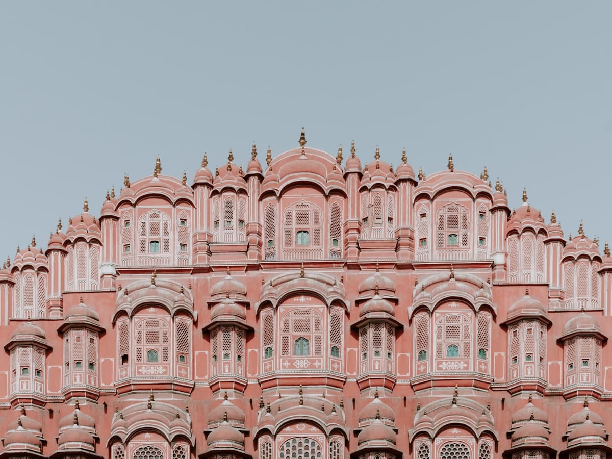 Pink and white sandstone structure under a clear sky