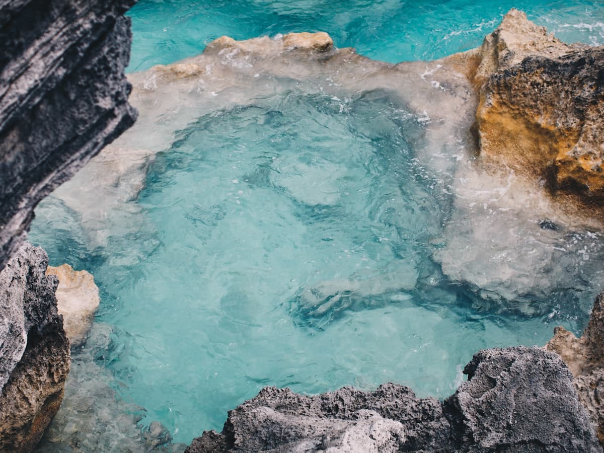 Top view of a body of water surrounded by rocks