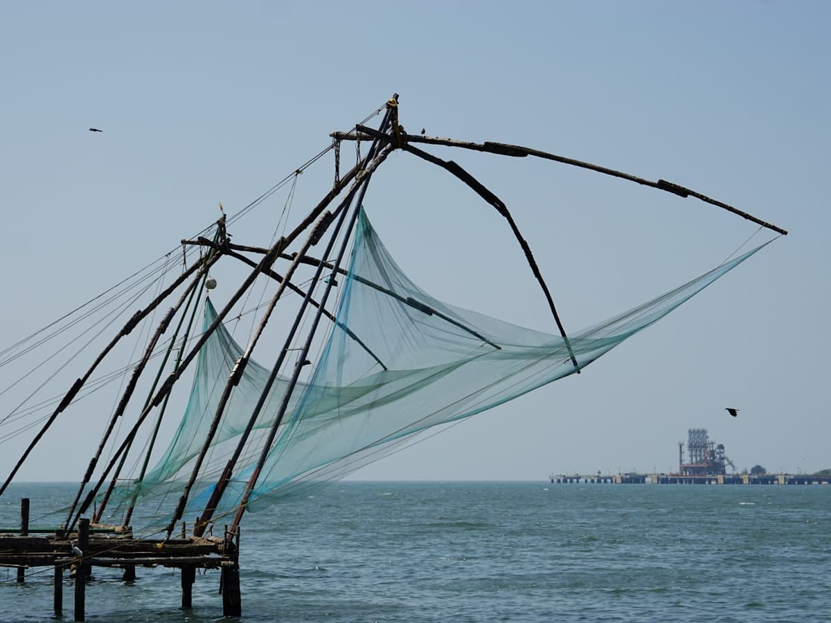 Large Chinese fishing nets standing over the ocean
