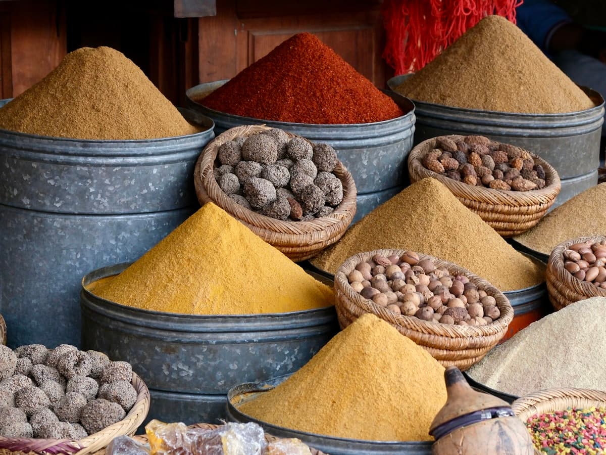 Colourful spices and dried goods displayed in a market
