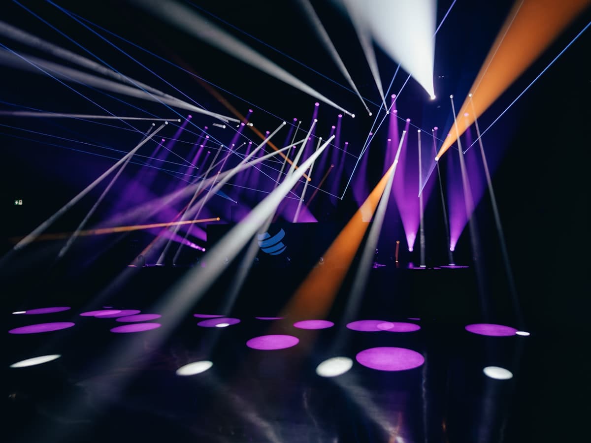 Purple, orange and blue stage lights in the dark